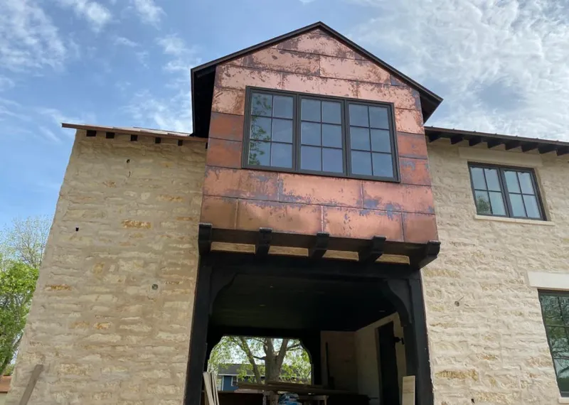 Copper metal panel facade on a stone building for Metal Roof Coating in Pico Rivera